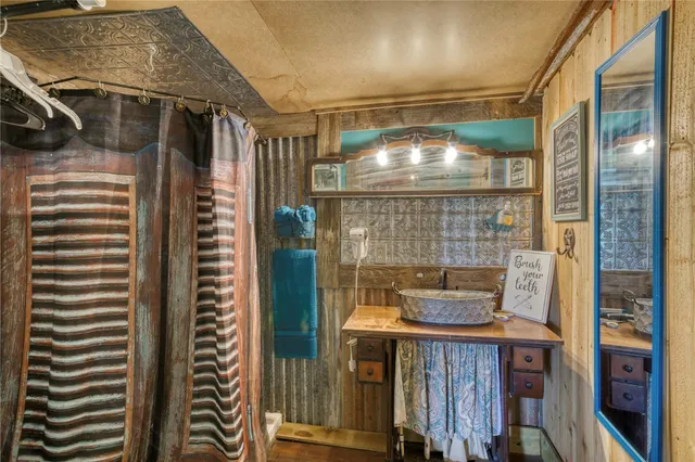 a bathroom with a bathtub and shower