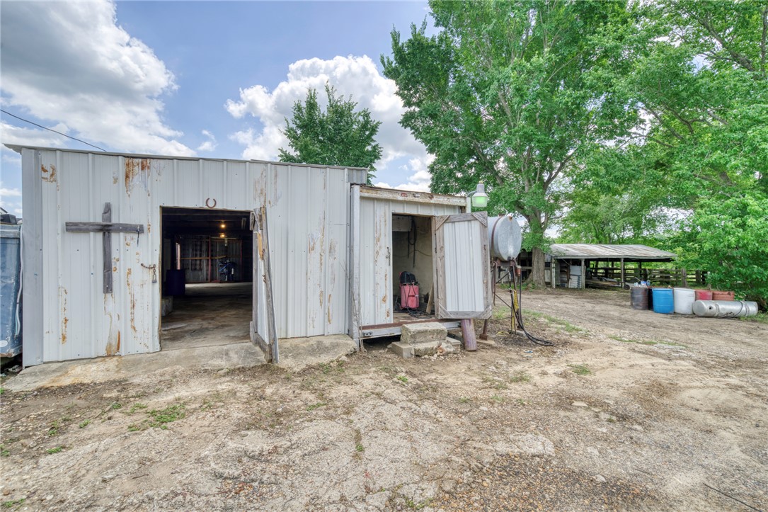 1681 Union Road Madisonville, TX 77864 - Photo 7 of 50 a view of house with backyard and seating space