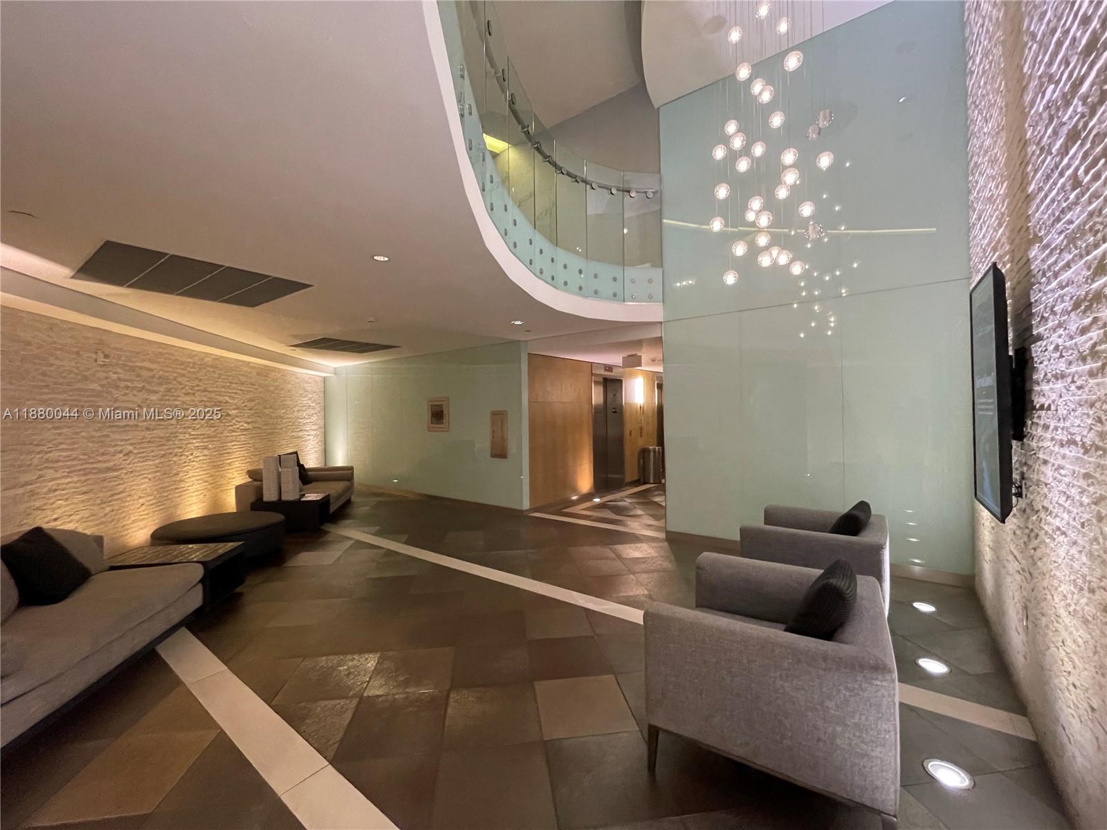 92 Southwest 3rd Street, Unit 1602 Miami, FL 33130 - Photo 34 of 48 a living room with furniture and a chandelier