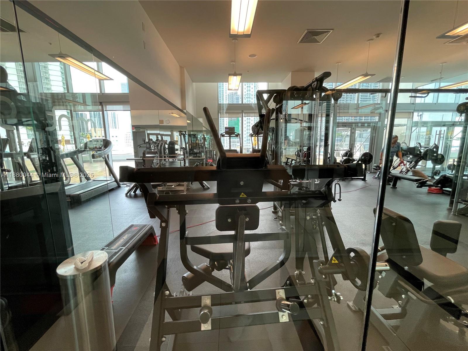 92 Southwest 3rd Street, Unit 1602 Miami, FL 33130 - Photo 37 of 48 a view of a dining room with furniture window and wooden floor