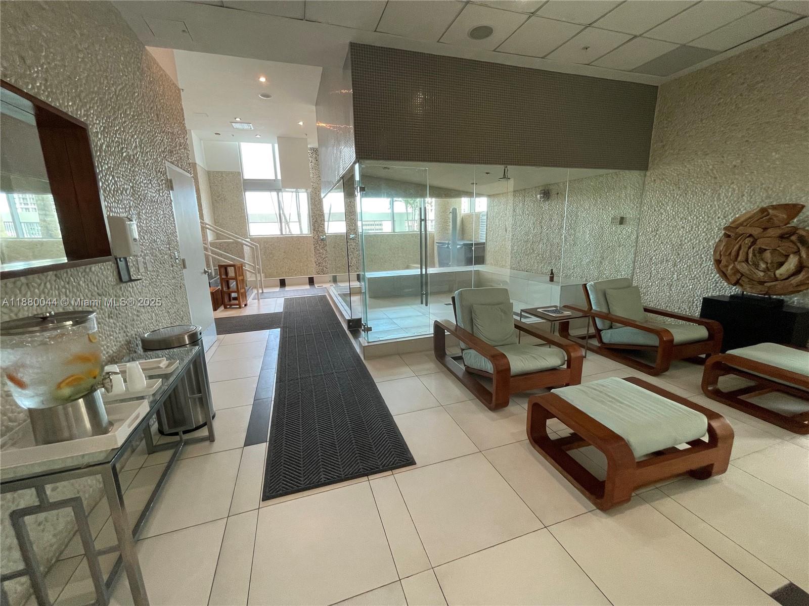 92 Southwest 3rd Street, Unit 1602 Miami, FL 33130 - Photo 39 of 48 a living room with furniture and a flat screen tv