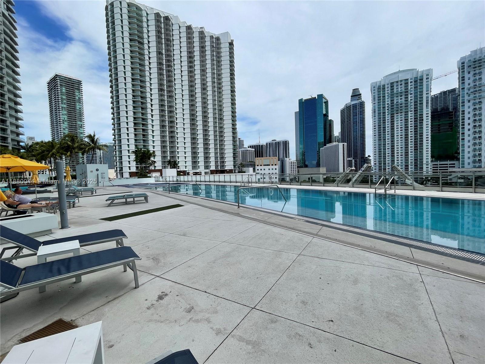 92 Southwest 3rd Street, Unit 1602 Miami, FL 33130 - Photo 42 of 48 a building with river in front of it