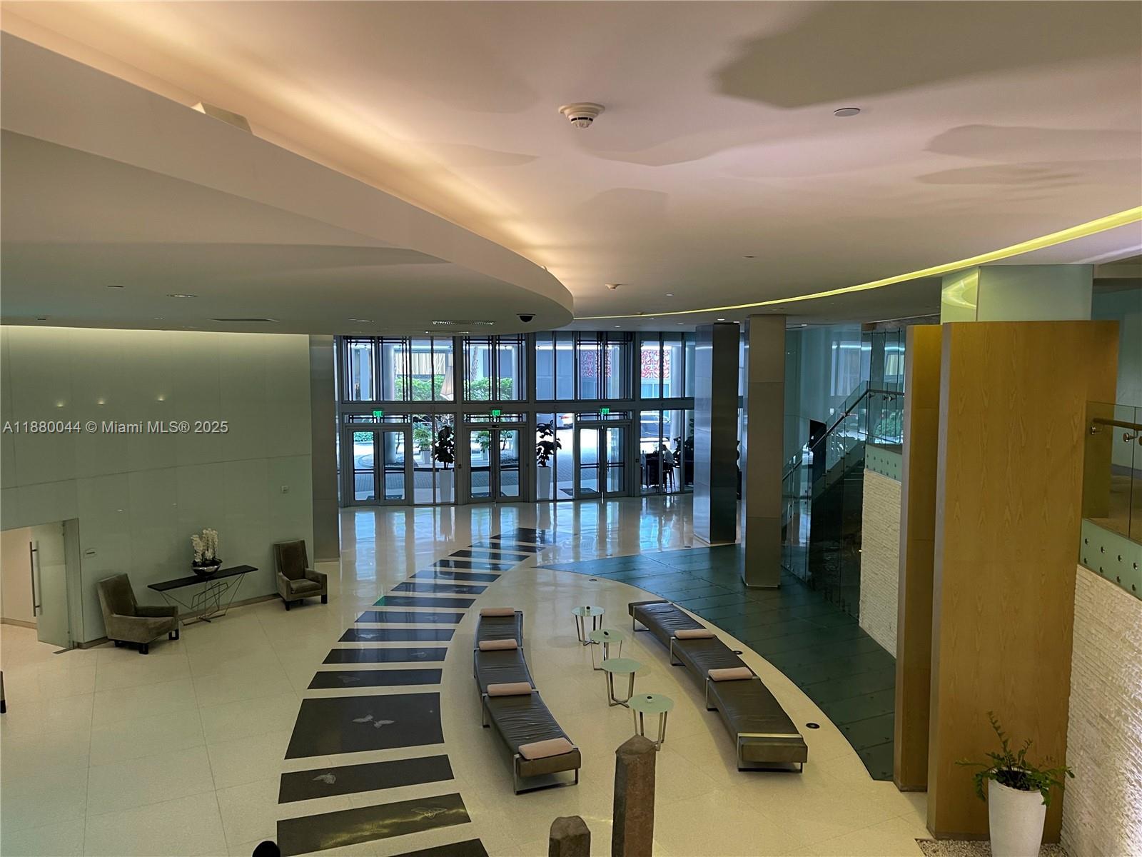 92 Southwest 3rd Street, Unit 1602 Miami, FL 33130 - Photo 47 of 48 workspace with wooden floor and stairs