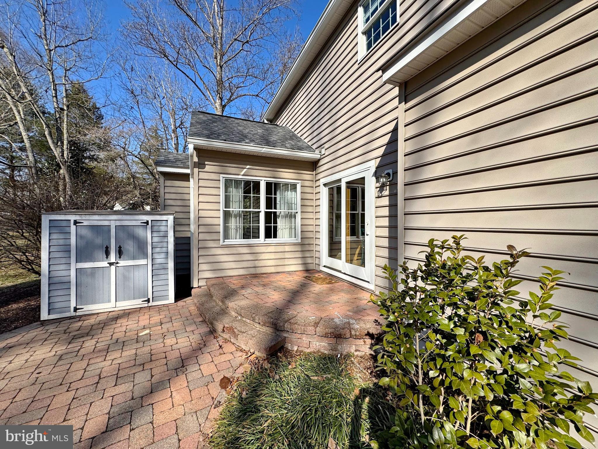 4060 Loving Drive Dunkirk, MD 20754 - Photo 22 of 83 a view of a backyard with plants and large tree