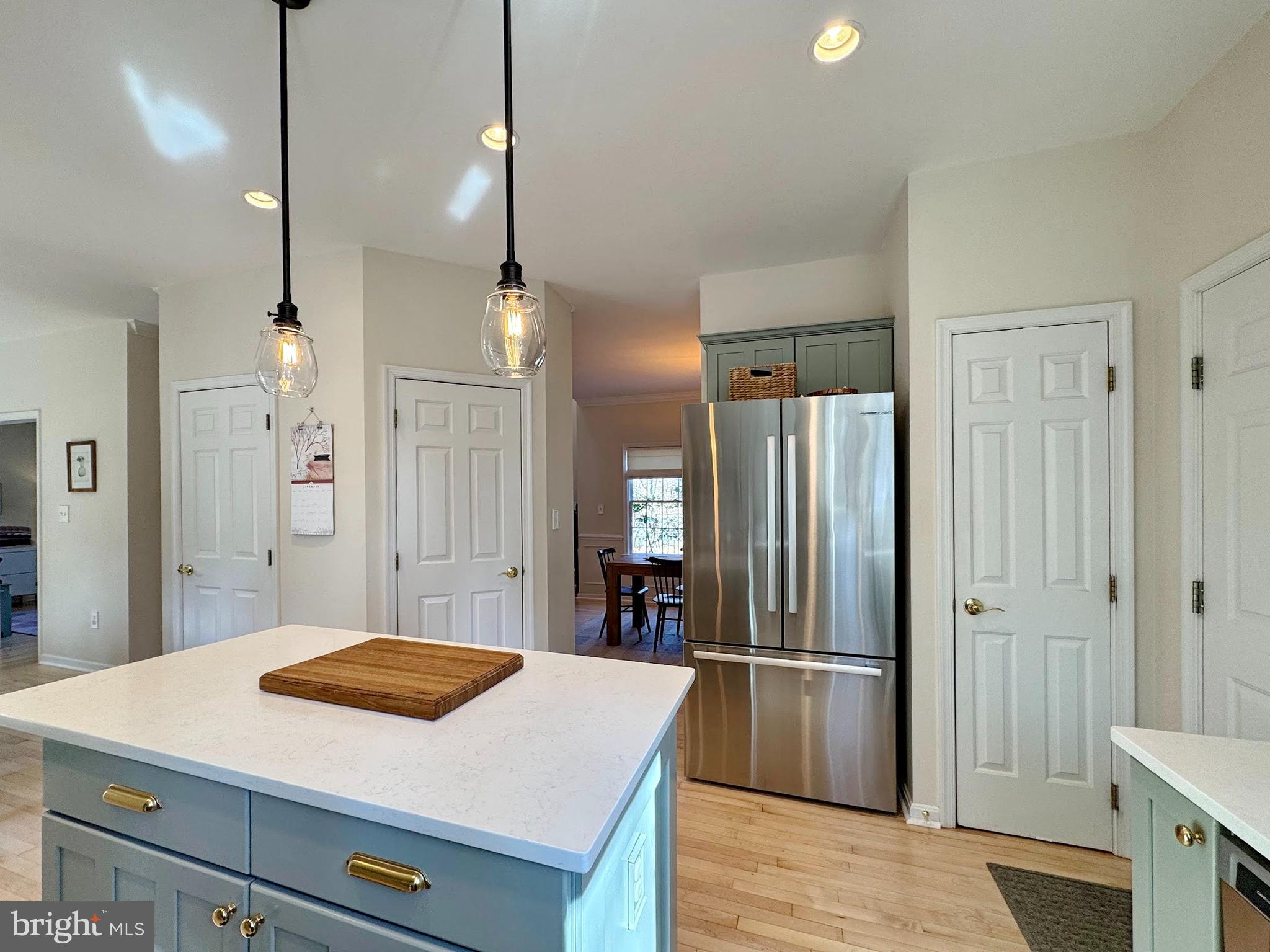 4060 Loving Drive Dunkirk, MD 20754 - Photo 39 of 83 a kitchen with stainless steel appliances a refrigerator and a stove top oven