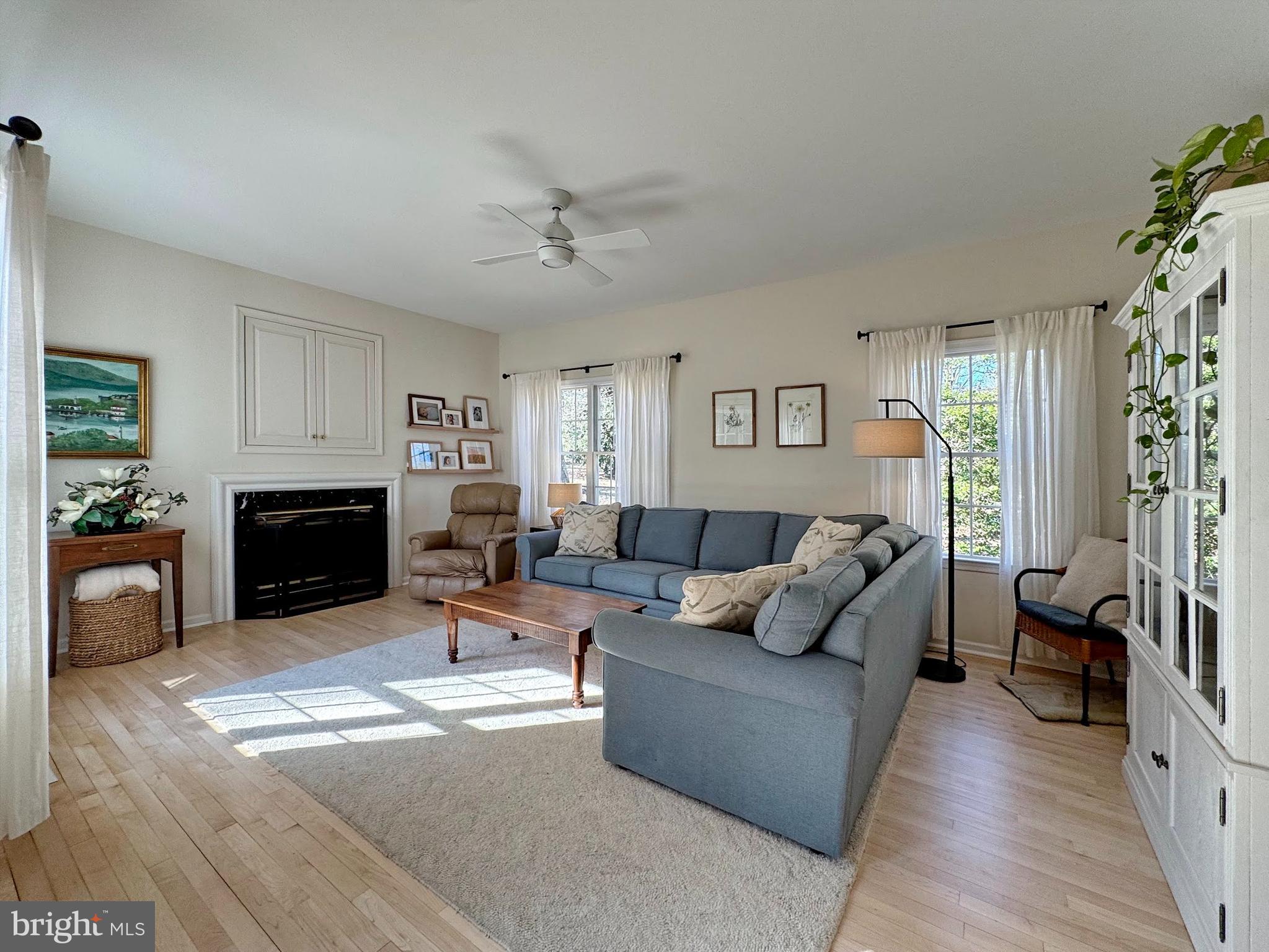 4060 Loving Drive Dunkirk, MD 20754 - Photo 49 of 83 a living room with furniture a fireplace and a flat screen tv