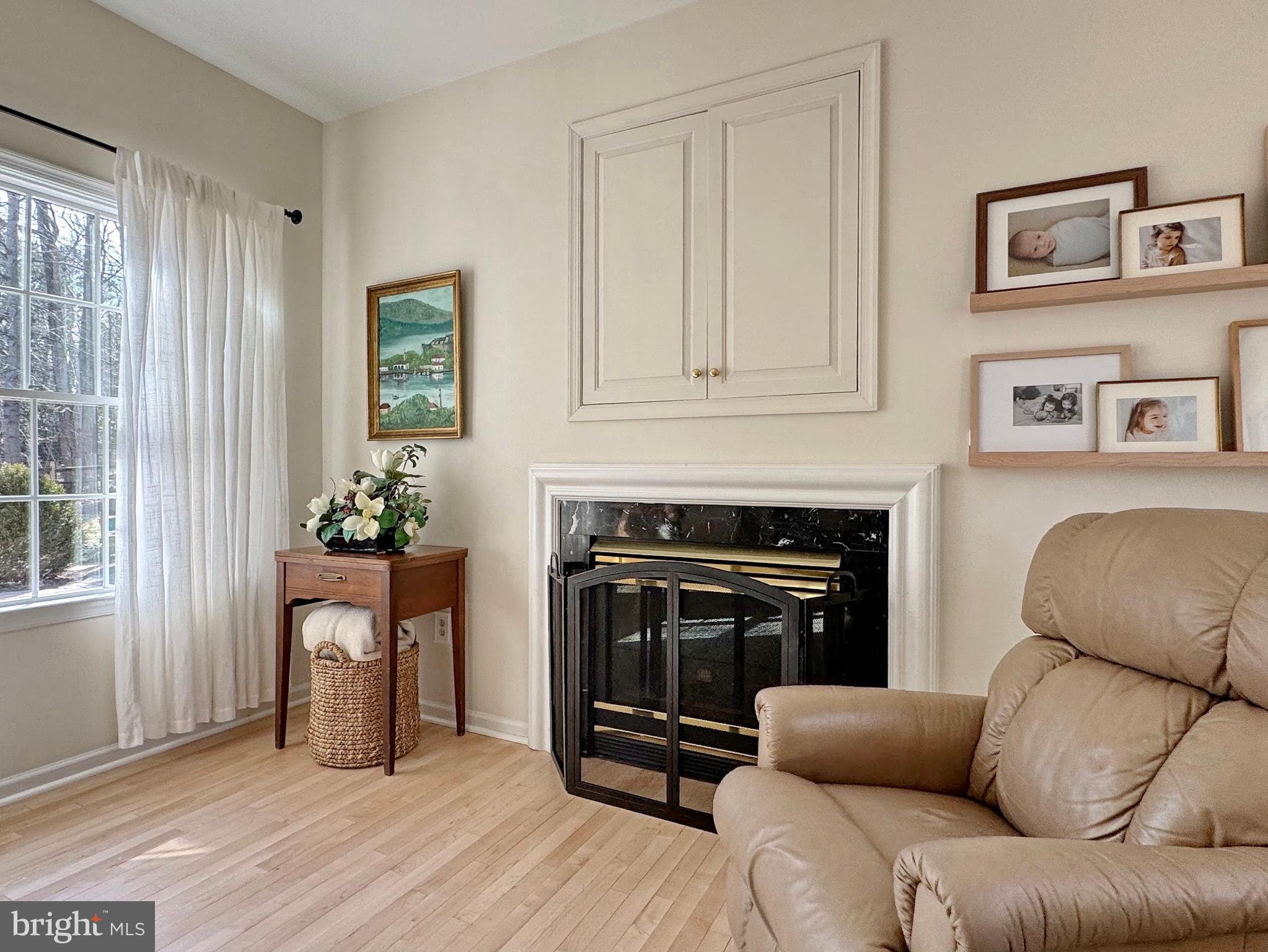 4060 Loving Drive Dunkirk, MD 20754 - Photo 50 of 83 a living room with furniture a fireplace and a window