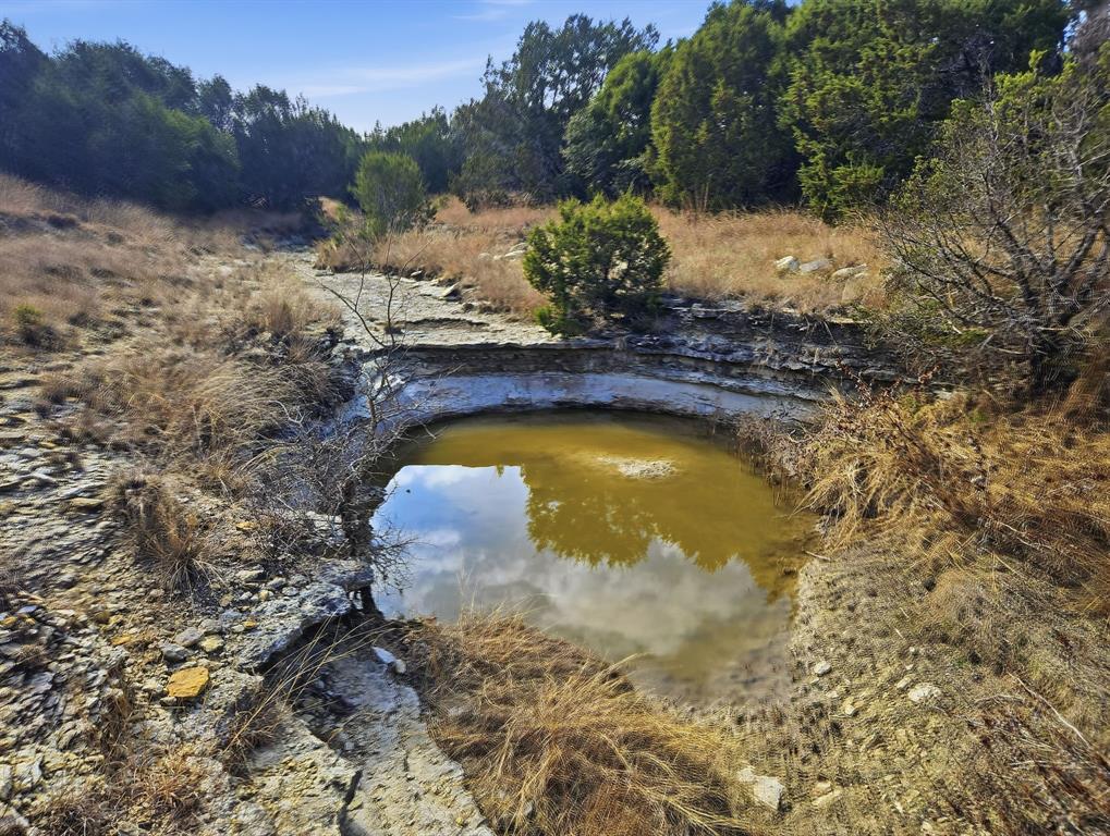162 County Road 162 Evant, TX 76525 - Photo 13 of 33 a view of a swimming pool with a yard