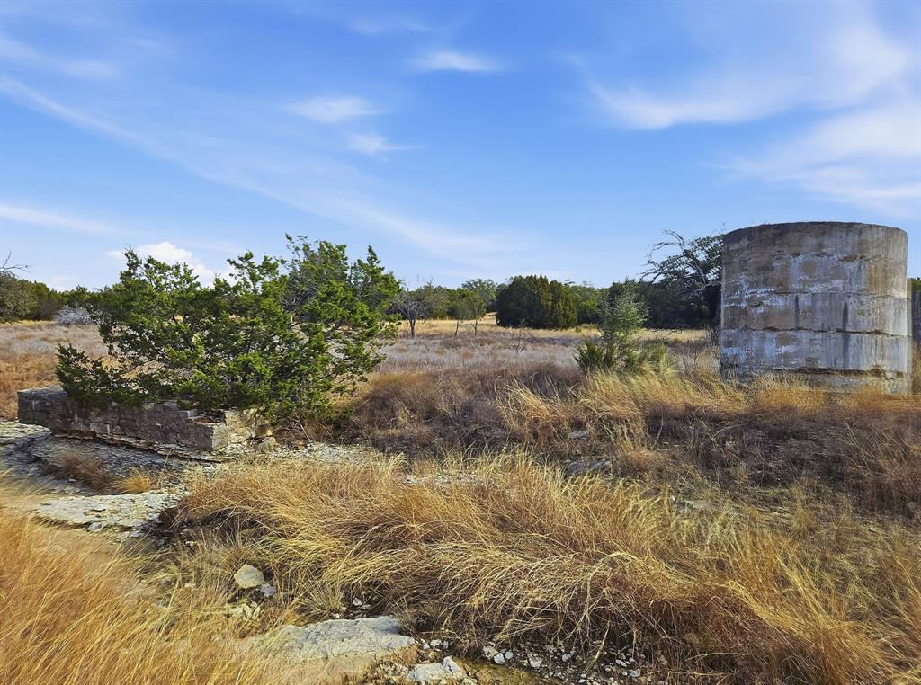 162 County Road 162 Evant, TX 76525 - Photo 3 of 33 a view of a dry yard with wooden fence