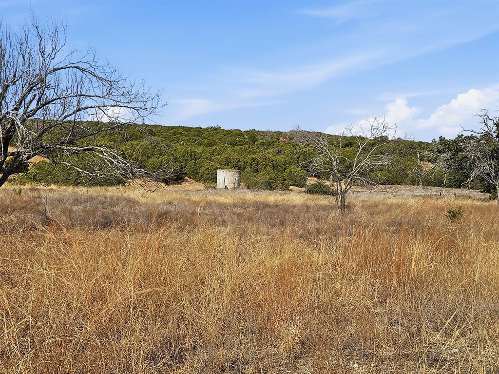 162 County Road 162 Evant, TX 76525 - Photo 7 of 33 a view of a road with a building in the background