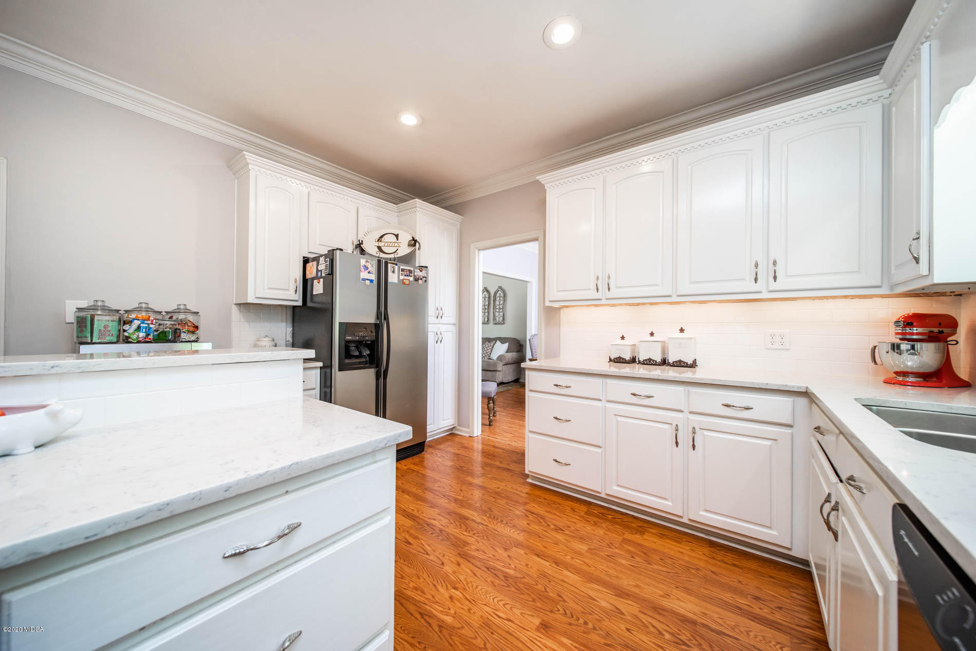 245 Beacon Hill Road Macon, GA 31210 - Photo 14 of 39 a kitchen with granite countertop cabinets stainless steel appliances and a counter space