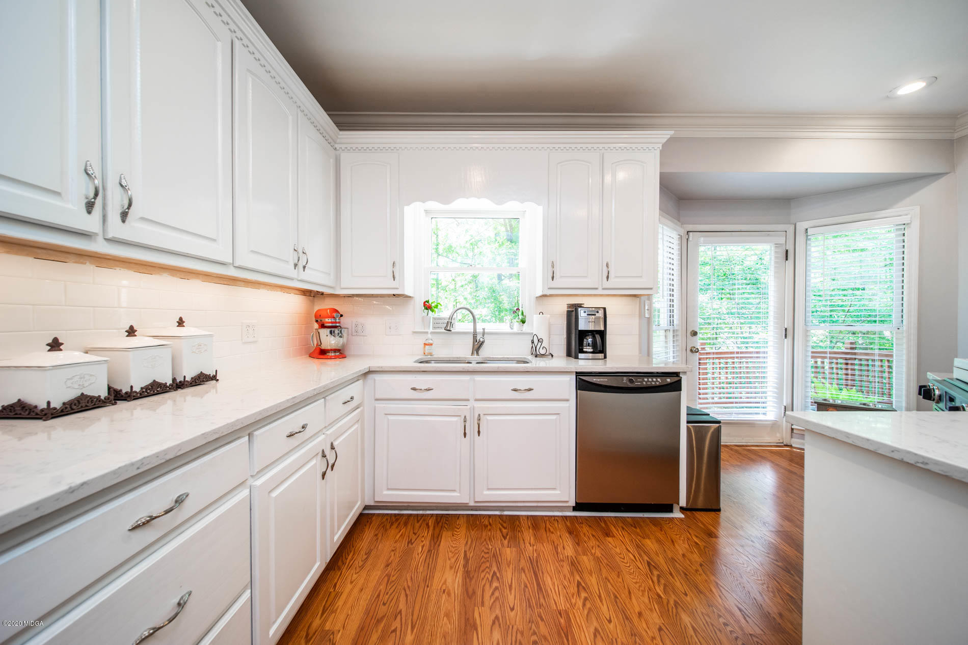 245 Beacon Hill Road Macon, GA 31210 - Photo 15 of 39 a kitchen with sink cabinets and wooden floor