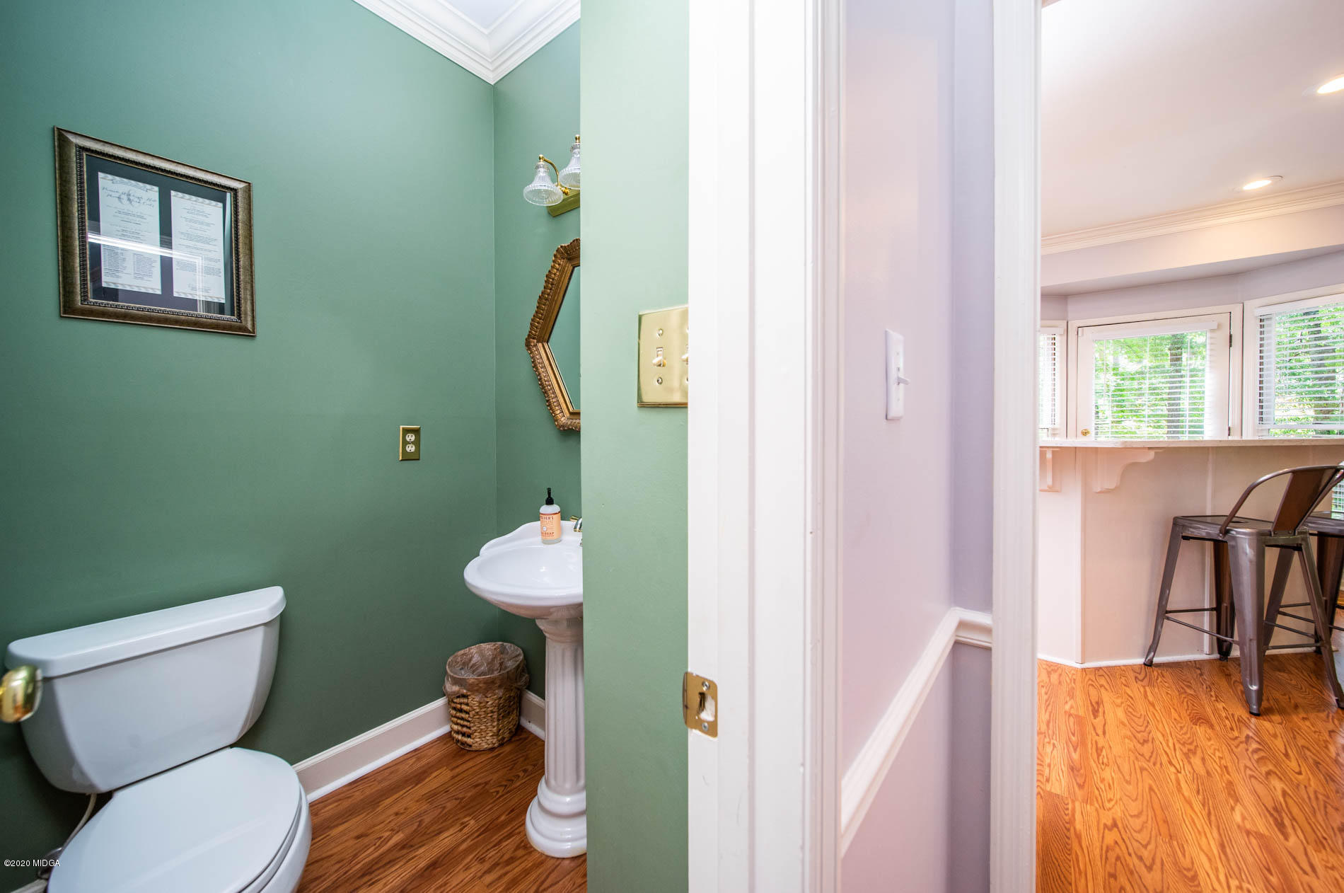 245 Beacon Hill Road Macon, GA 31210 - Photo 21 of 39 a bathroom with a toilet and a sink