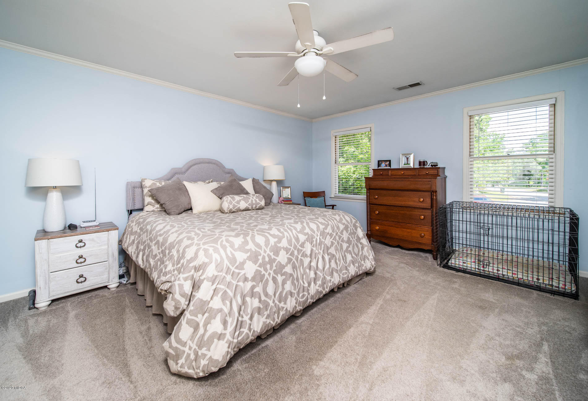 245 Beacon Hill Road Macon, GA 31210 - Photo 22 of 39 a bedroom with a bed and a dresser