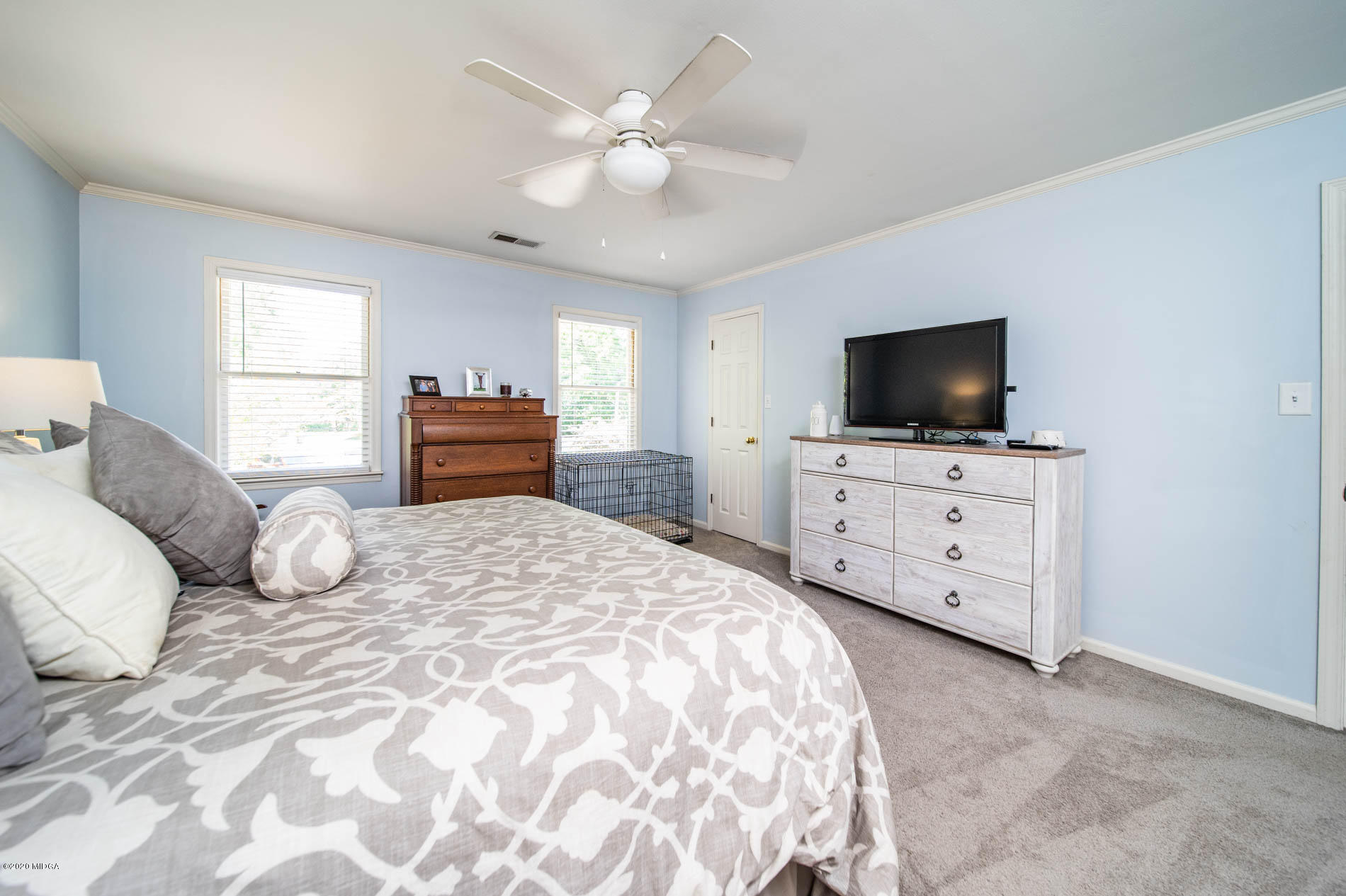 245 Beacon Hill Road Macon, GA 31210 - Photo 23 of 39 a bedroom with a bed and a flat screen tv
