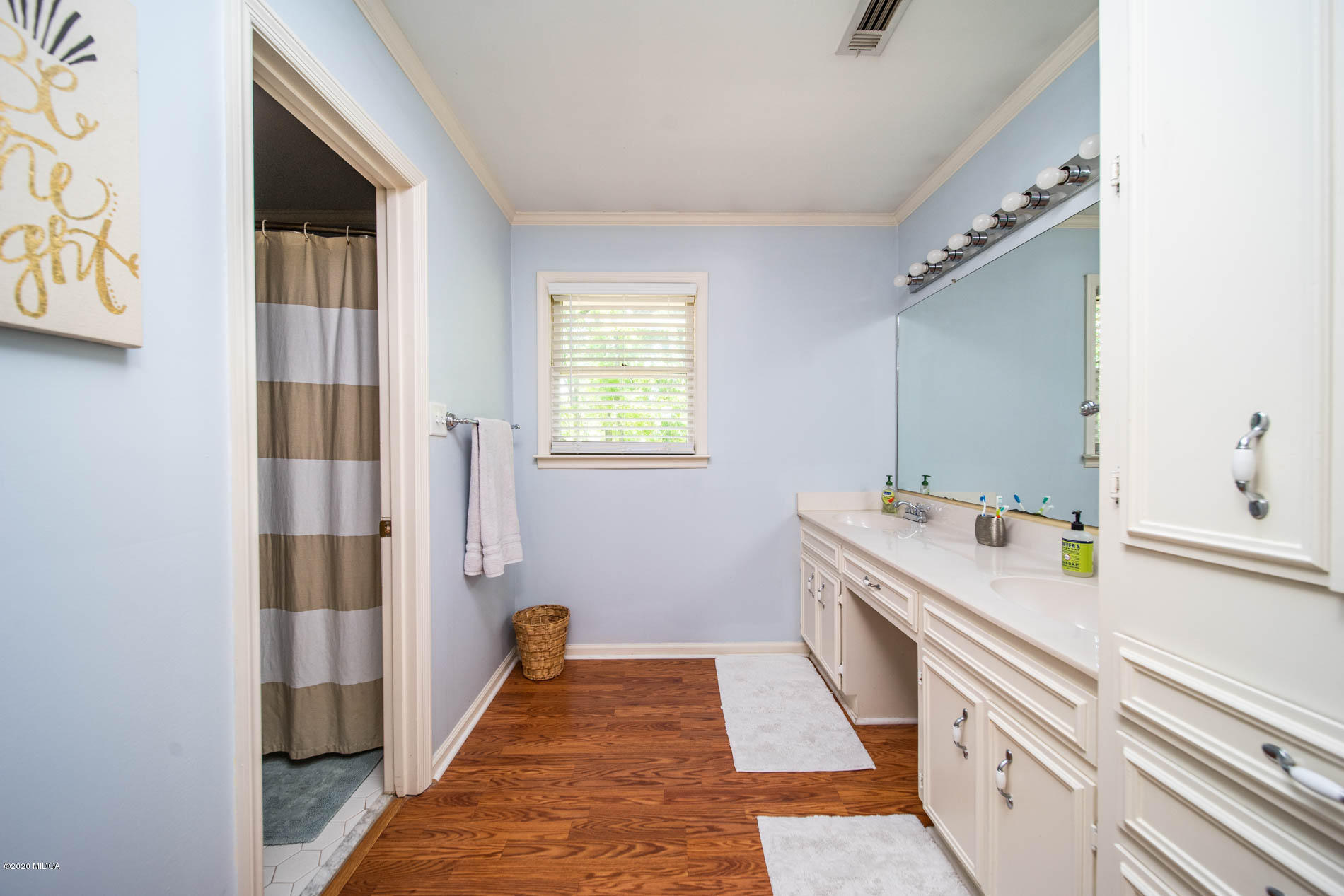 245 Beacon Hill Road Macon, GA 31210 - Photo 24 of 39 a bathroom with a sink a mirror and a shower