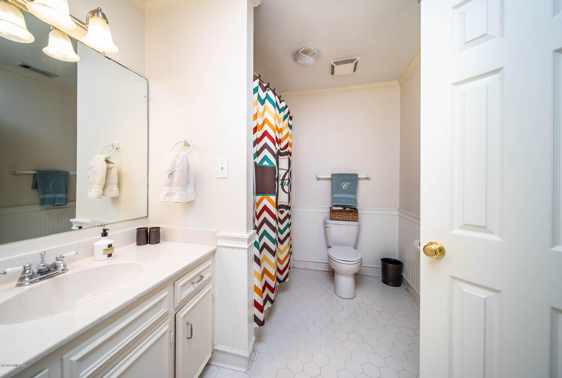 245 Beacon Hill Road Macon, GA 31210 - Photo 25 of 39 a bathroom with a sink mirror and toilet