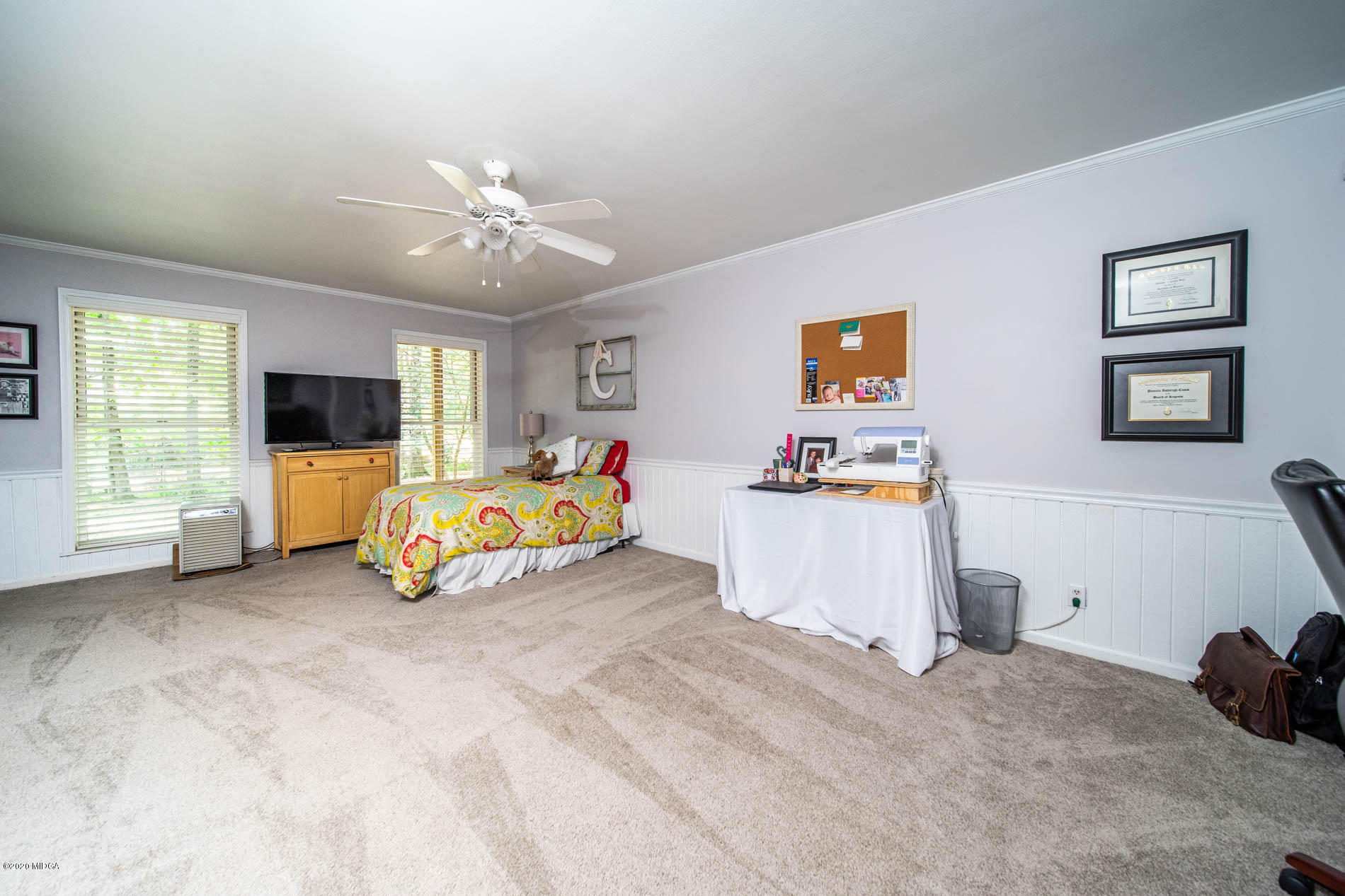 245 Beacon Hill Road Macon, GA 31210 - Photo 30 of 39 a view of a livingroom with a window and a flat screen tv