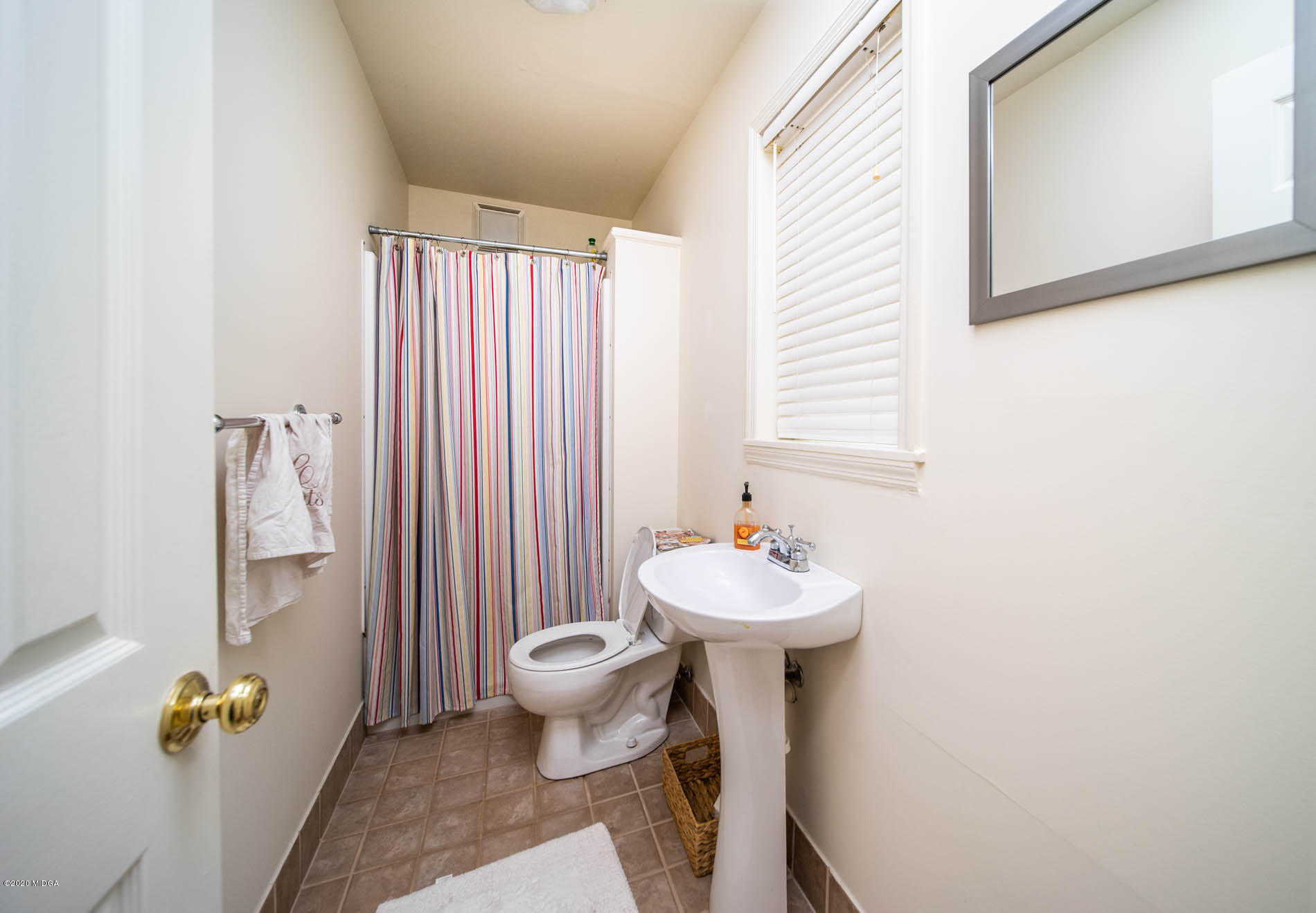 245 Beacon Hill Road Macon, GA 31210 - Photo 32 of 39 a bathroom with a sink toilet and shower