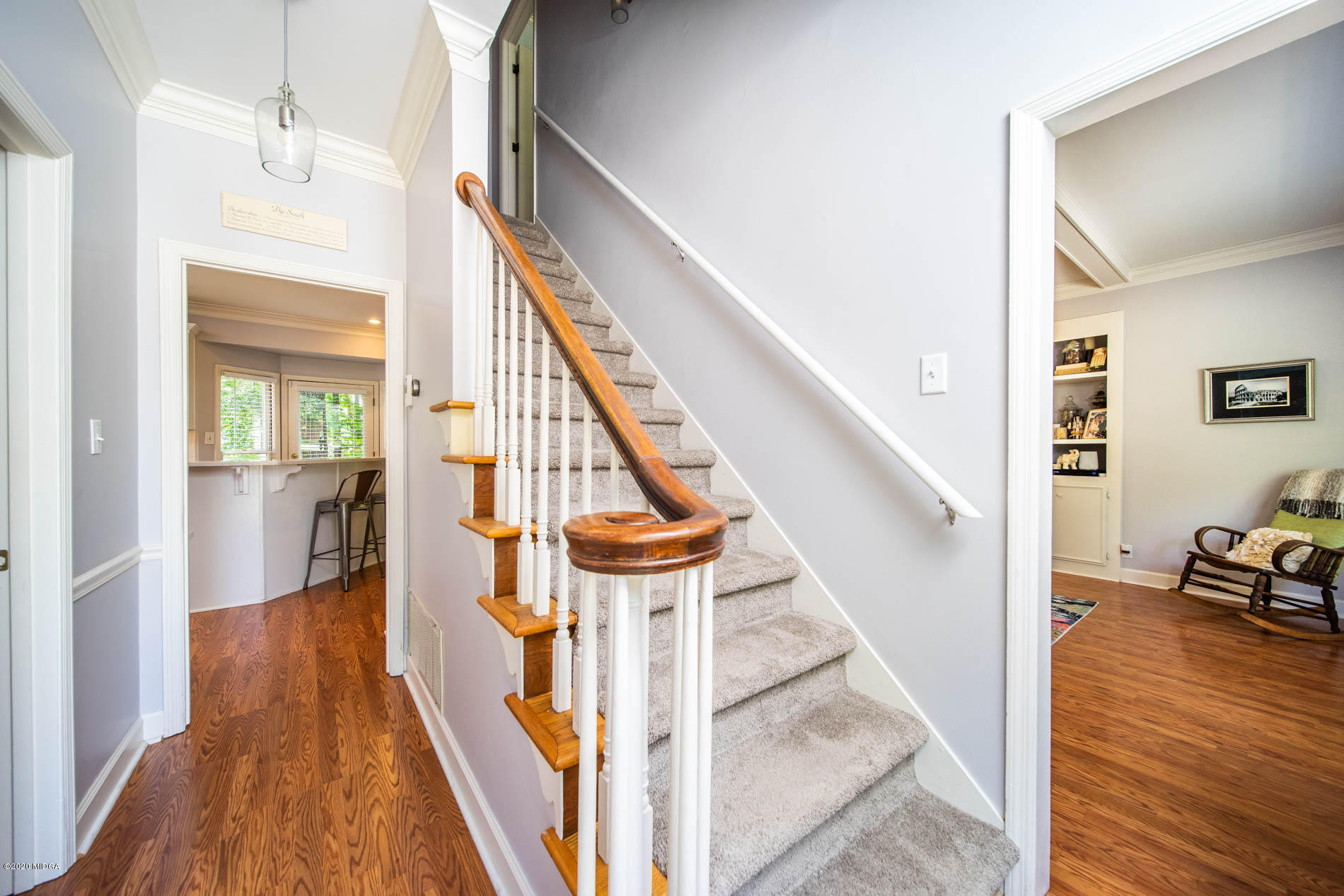 245 Beacon Hill Road Macon, GA 31210 - Photo 5 of 39 a view of a hallway with wooden floor and staircase