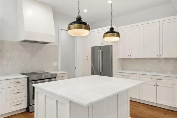 a kitchen with a table and chairs in it