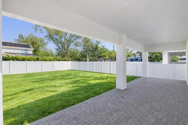a view of backyard with green space