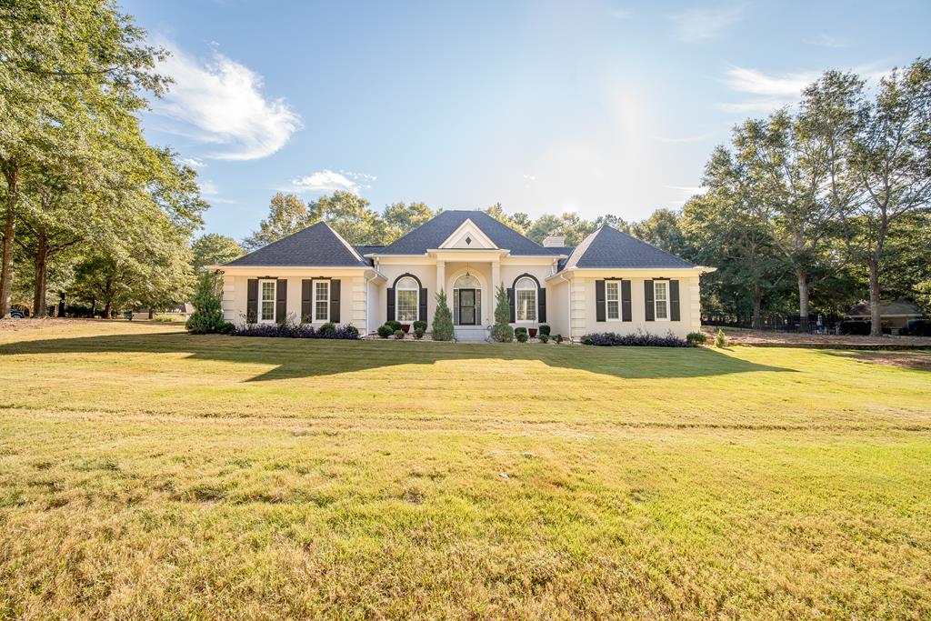 64 North Buckeye Loop Midland, GA 31820 - Photo 1 of 51 a house with swimming pool in front of it