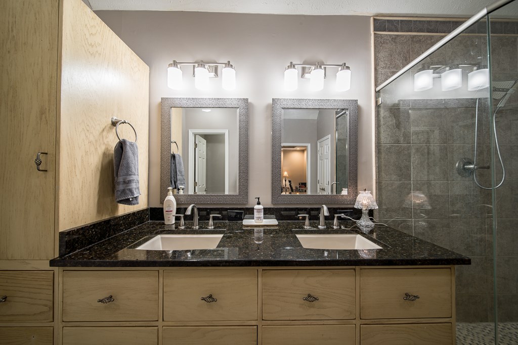 64 North Buckeye Loop Midland, GA 31820 - Photo 34 of 51 a bathroom with double sink and a mirror