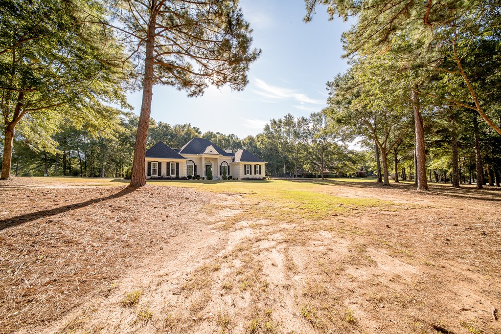 64 North Buckeye Loop Midland, GA 31820 - Photo 6 of 51 a house with trees in front of it