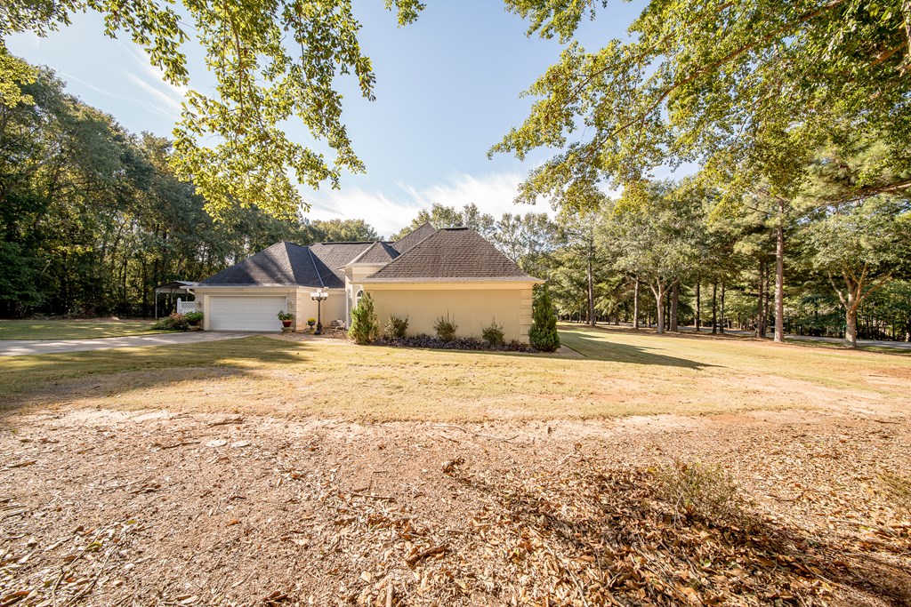 64 North Buckeye Loop Midland, GA 31820 - Photo 8 of 51 a house view with a outdoor space