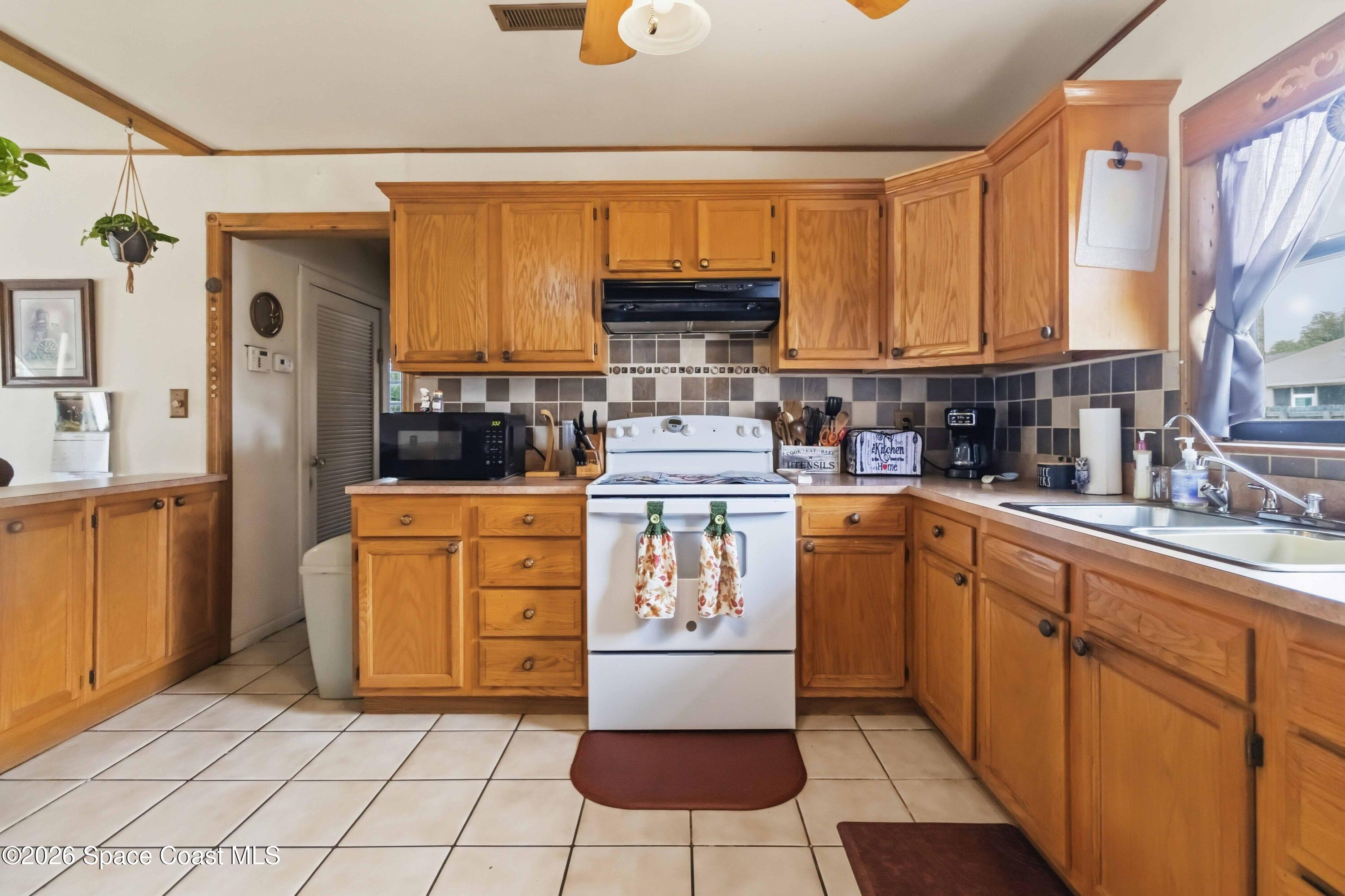 1420 Tate Street Cocoa, FL 32922 - Photo 9 of 19 Tons of Cabinet Storage!