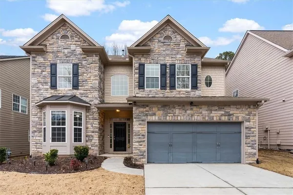 front view of a house with a yard