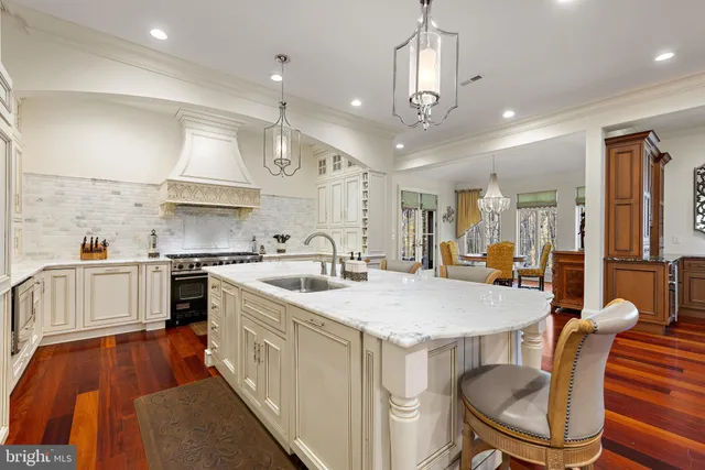 a view of a dining room with furniture wooden floor and a chandelier