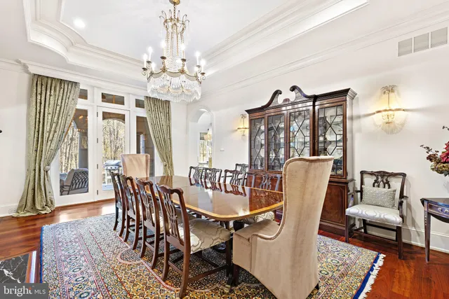 a living room with furniture and a mirror