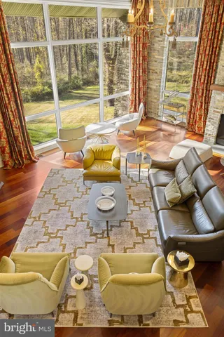 a view of a room with furniture and a floor to ceiling window