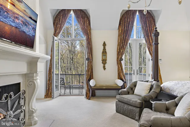 a living room with furniture gym equipment and large windows