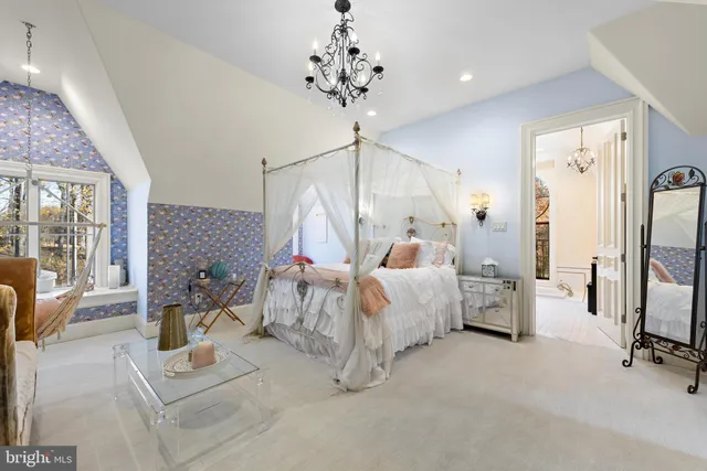 an aerial view of a house with a swimming pool