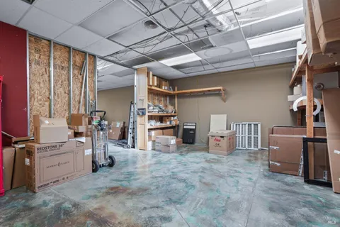 a room with a wooden floor and a table