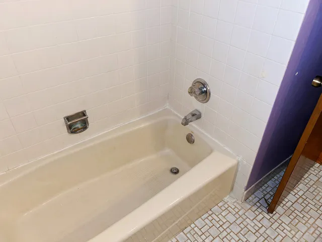 a kitchen with stainless steel appliances granite countertop a sink cabinets and wooden floor