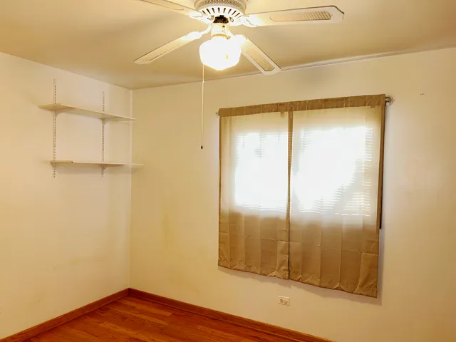 a view of a big room with wooden cabinets