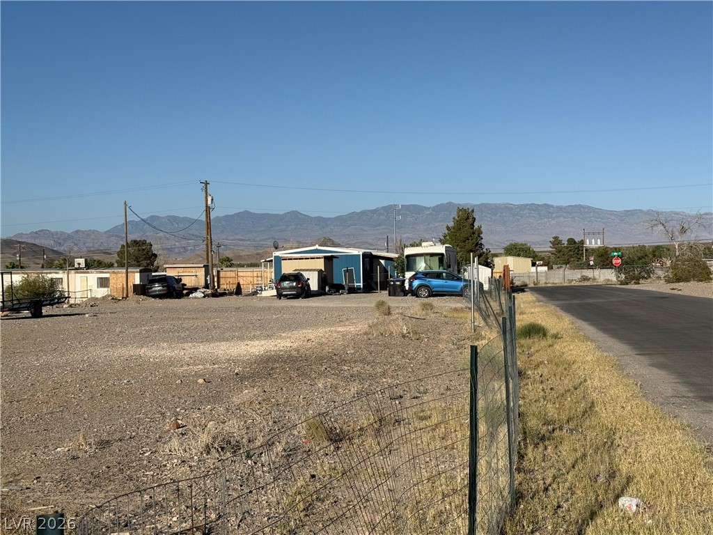 975 Sky Road Indian Springs, NV 89018 - Photo 4 of 4 A spacious desert property offering ample outdoor area and distant mountain views.