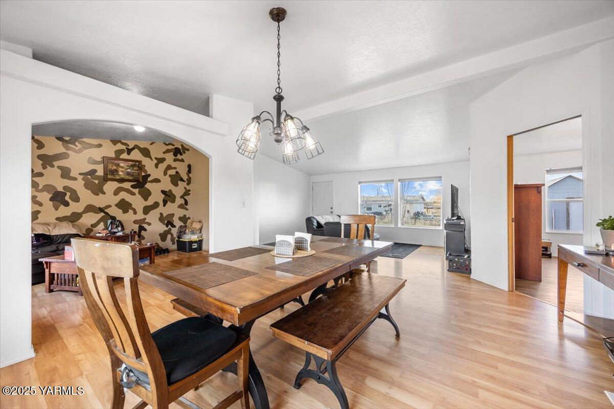 183 Puterbaugh Road Grandview, WA 98930 - Photo 5 of 36 a view of a dining room with furniture wooden floor and chandelier