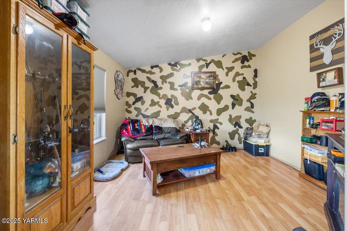 183 Puterbaugh Road Grandview, WA 98930 - Photo 8 of 36 a room with toys and wooden floor