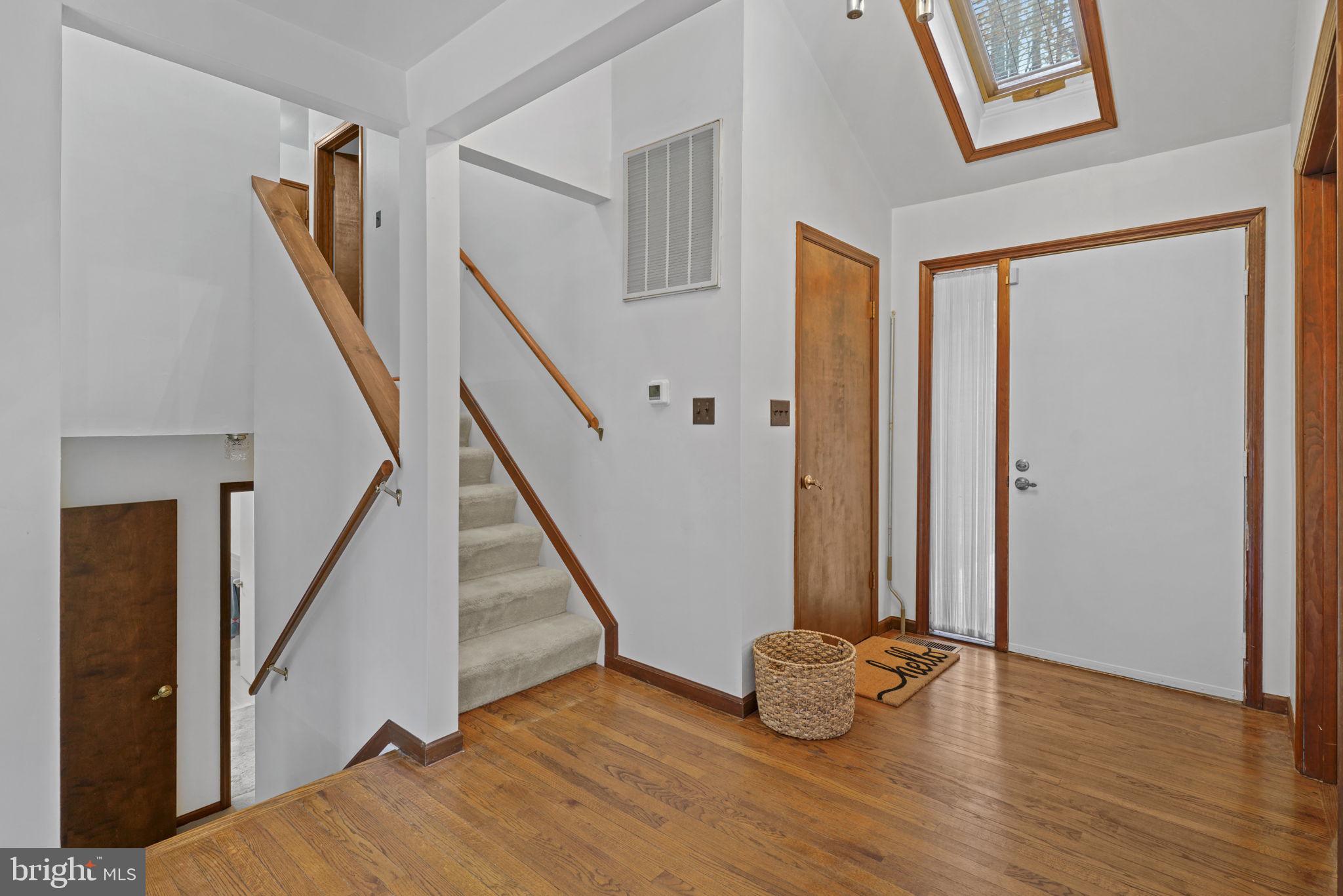 520 Chesapeake Beach Road Owings, MD 20736 - Photo 2 of 70 a view of an entryway with wooden floor and stairs