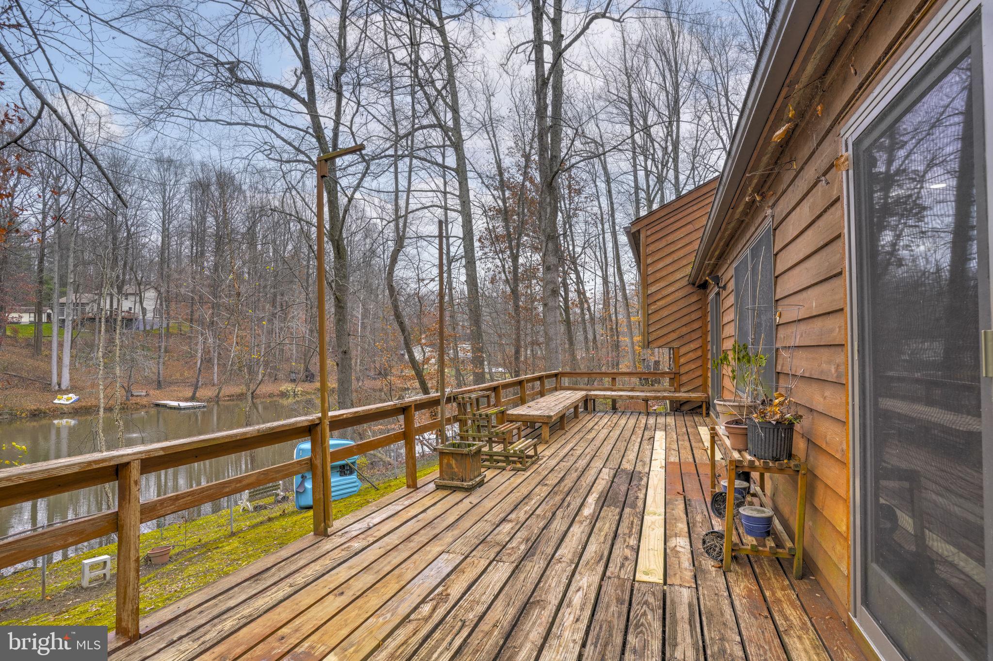 520 Chesapeake Beach Road Owings, MD 20736 - Photo 58 of 70 a view of balcony with wooden floor and fence
