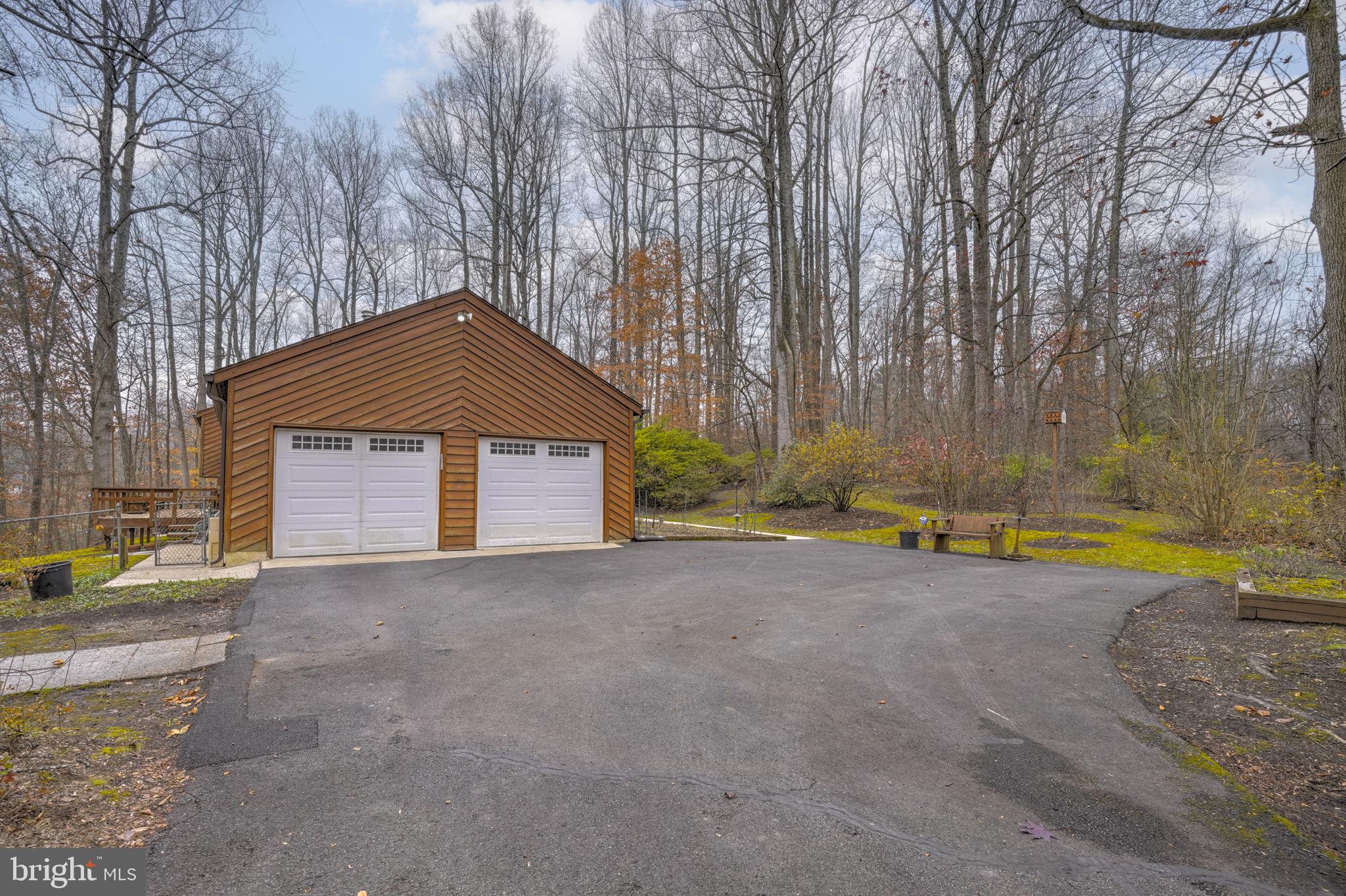 520 Chesapeake Beach Road Owings, MD 20736 - Photo 62 of 70 a view of yellow house with a yard and large trees