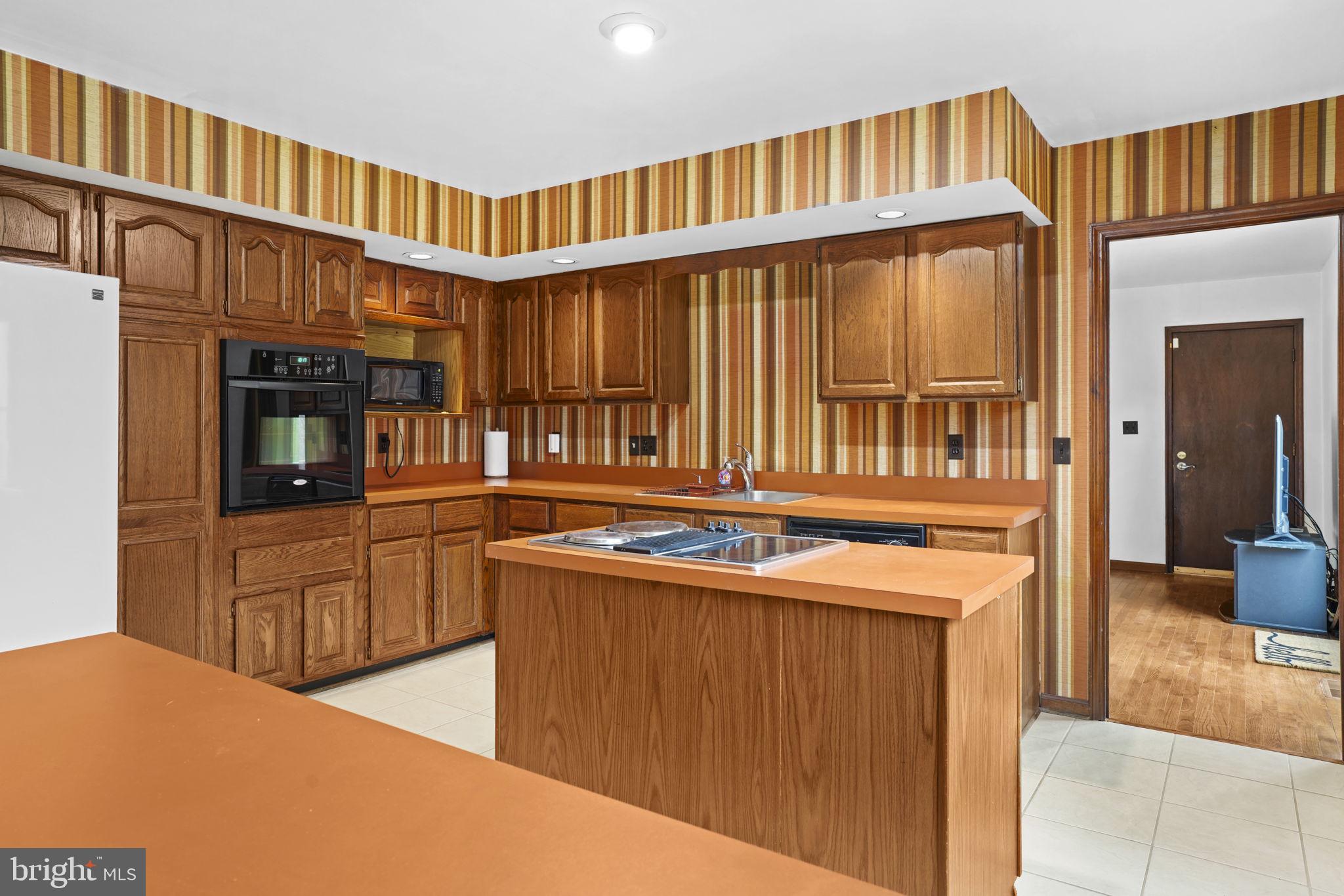 520 Chesapeake Beach Road Owings, MD 20736 - Photo 9 of 70 KITCHEN WITH CENTER ISLAND