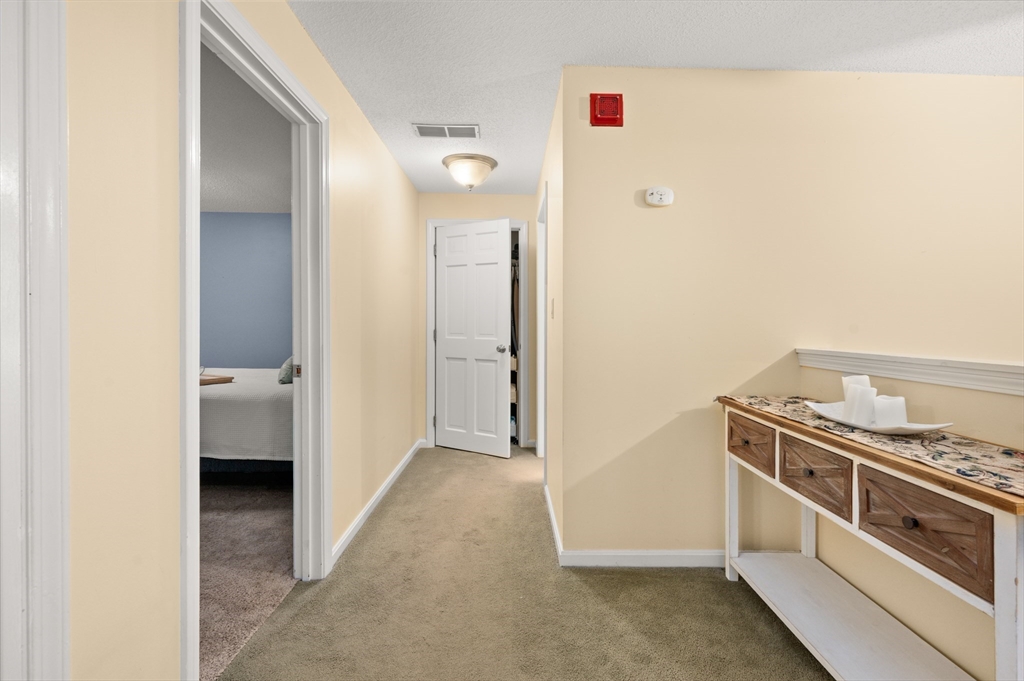 25 Shea Street, Unit 8 Dracut, MA 01826 - Photo 25 of 37 a view of a kitchen cabinets and a stove