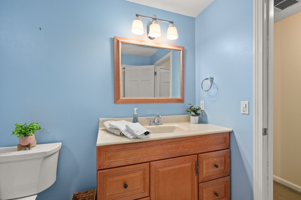 25 Shea Street, Unit 8 Dracut, MA 01826 - Photo 33 of 37 a bathroom with a sink and a mirror