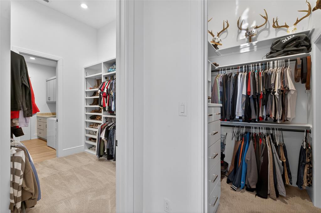 2804 Buchanan Road Hallsville, TX 75650 - Photo 23 of 40 a view of walk in closet with clothes and shoes